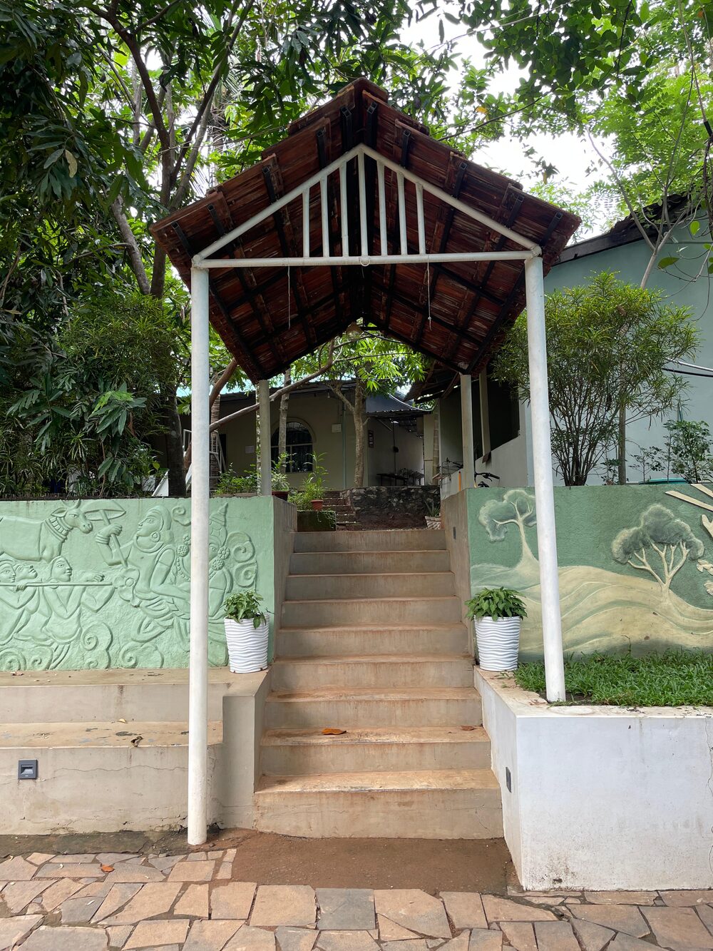 Stairway entrance beneath a traditional wooden pavilion